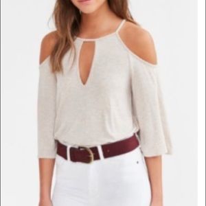 Cream shirt with wide sleeves and shoulder cutout